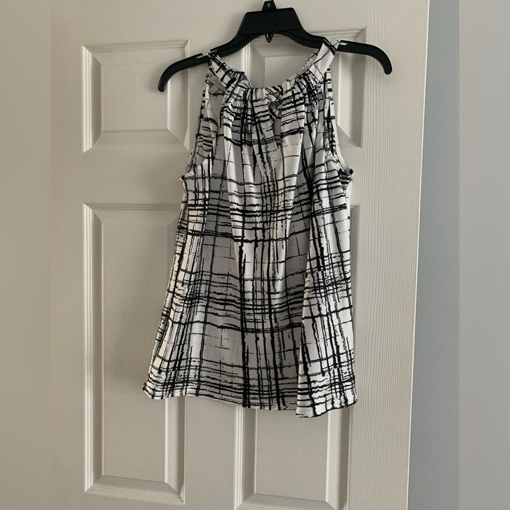 The limited black-and-white halter top ties at back and neck